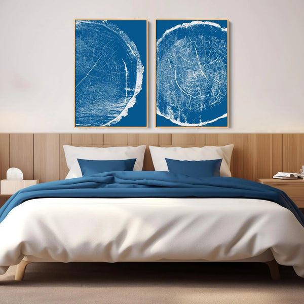 A minimalist tree ring canvas wall art set in blue. 