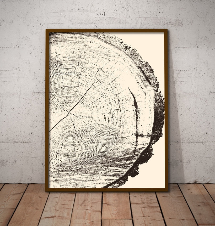 A large vertical art print of a woodcut framed.