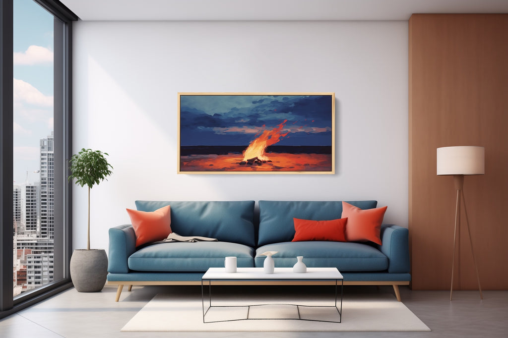 A framed coastal landscape wall art featuring a campfire on the beach.