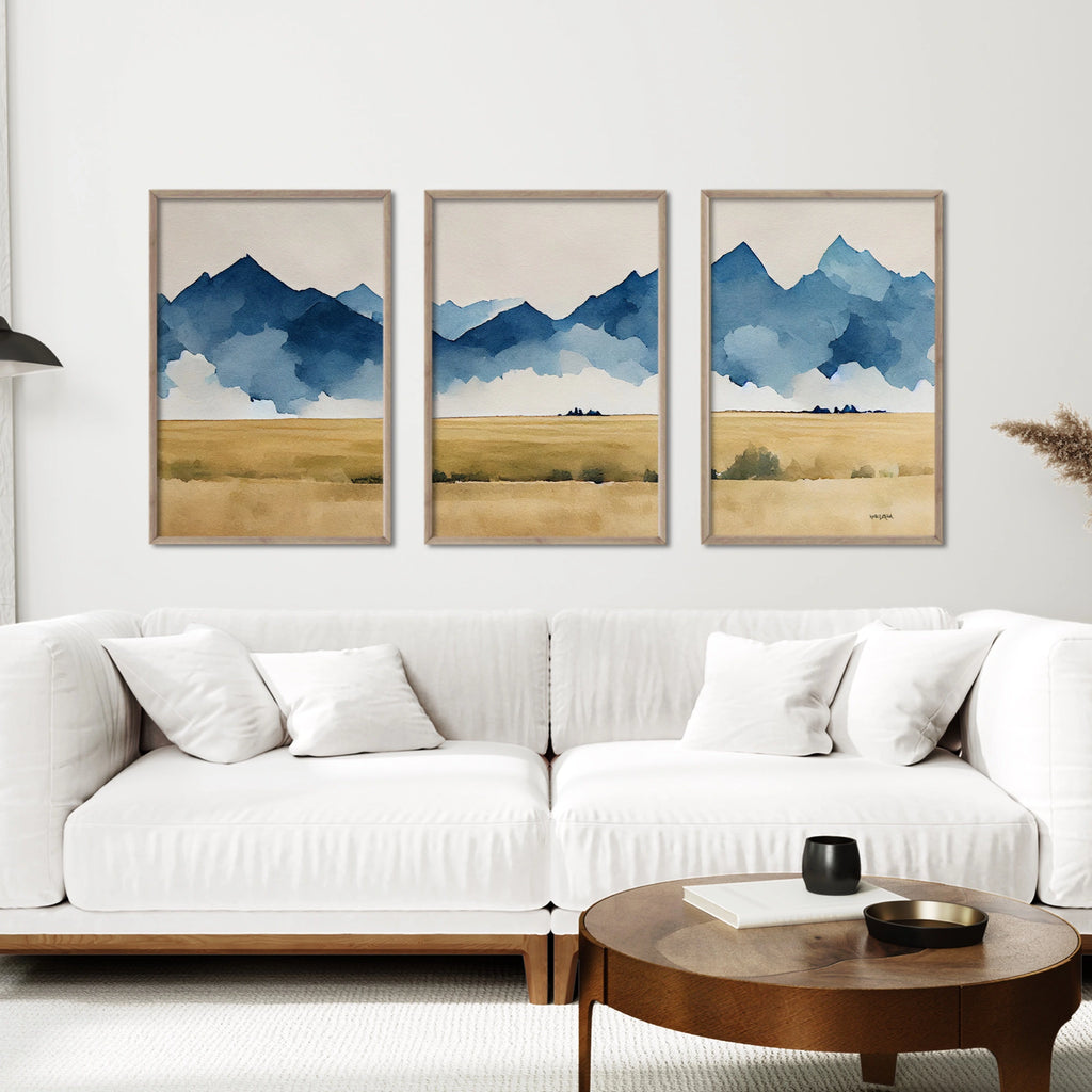A watercolor nature art print set featuring mountains above a countryside.