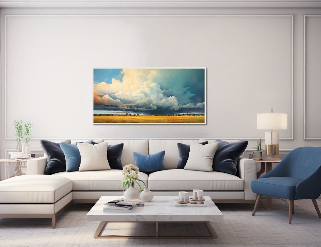 A framed landscape wall art featuring storm clouds rolling through countryside.