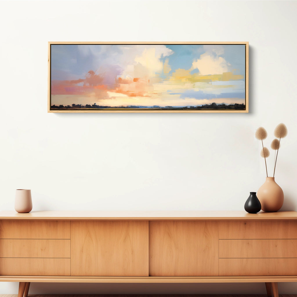 A framed abstract nature wall decor on stretched canvas in pastel colors.
