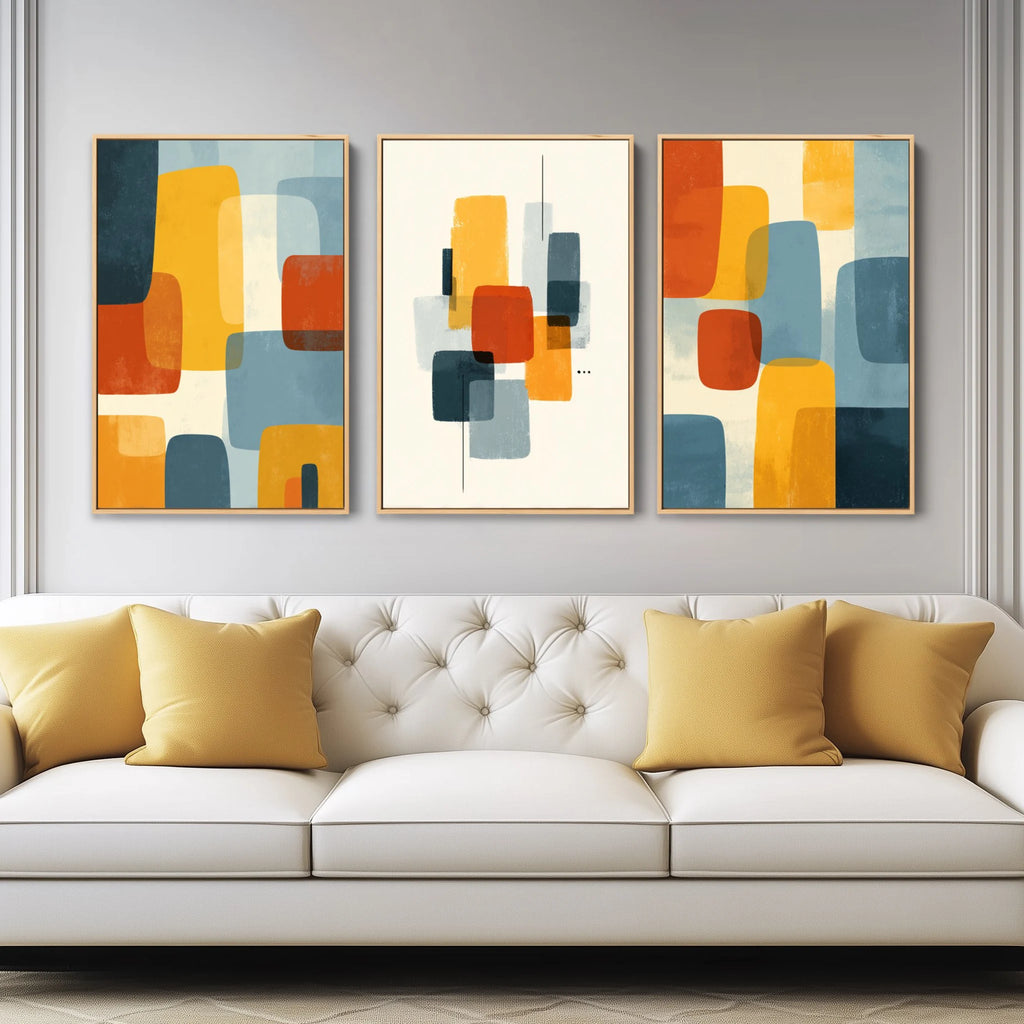 A set of 3 abstract prints features bold shapes and clean lines in a palette inspired by mid-century modern design.