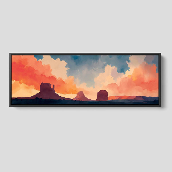 Extra wide framed artwork of a desert landscape with colorful clouds.