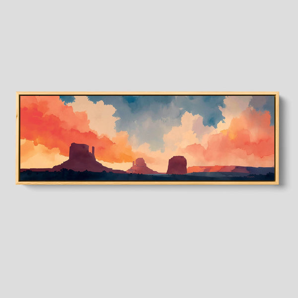 Framed artwork of a desert landscape with orange and blue clouds.