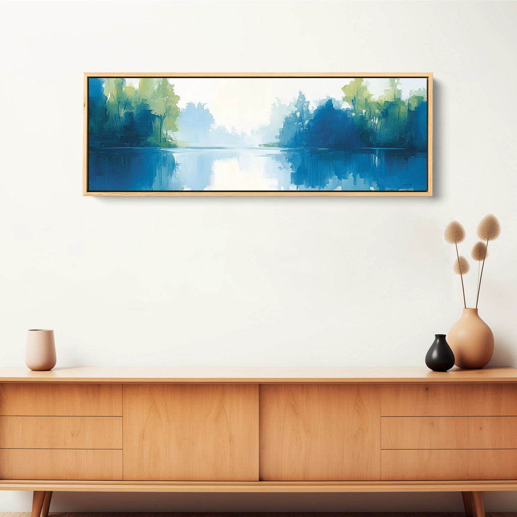 A calming scenery wall art piece featuring trees reflected in water.