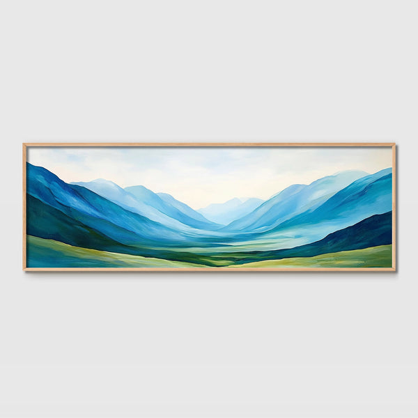 A framed peaceful landscape artwork in blue and green.