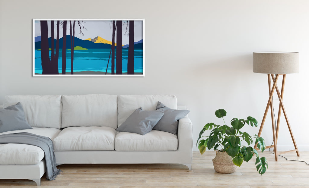 A framed Mount Shasta canvas wall art in shades of blue with a flash of morning light on Mount Shasta. 