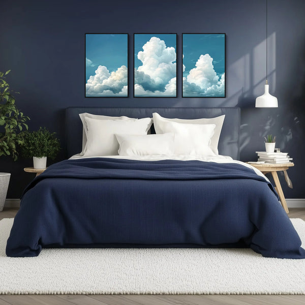 A set of 3 cloud prints, featuring soft, white puffy clouds drifting across a serene sky.
