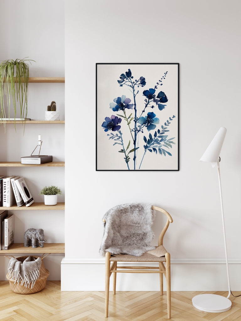 A framed floral watercolor artwork in indigo blue.