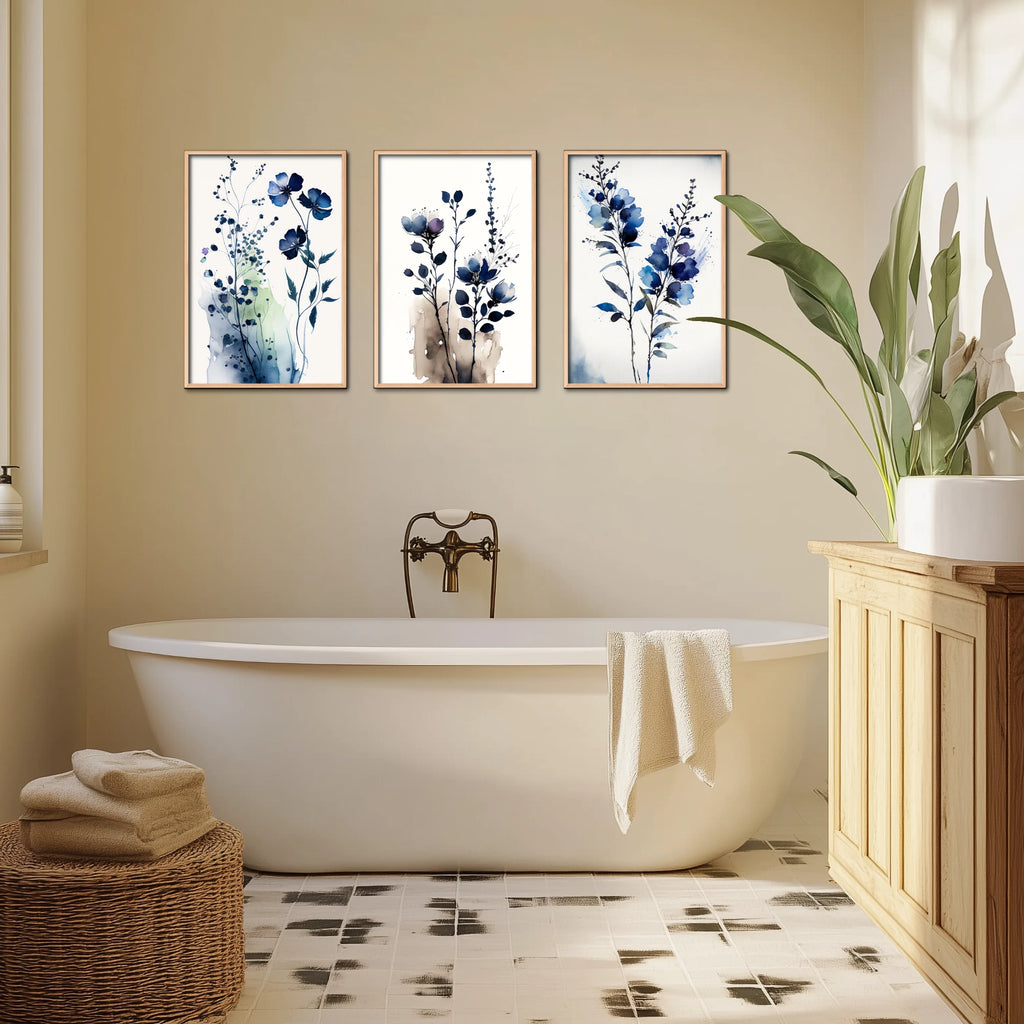 A 3 piece boho watercolor flower wall art set in blue tones.