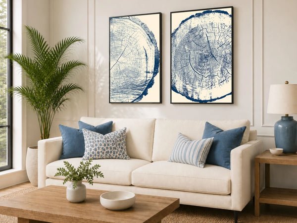 A set of two framed blue and cream tree-ring style wall art prints.