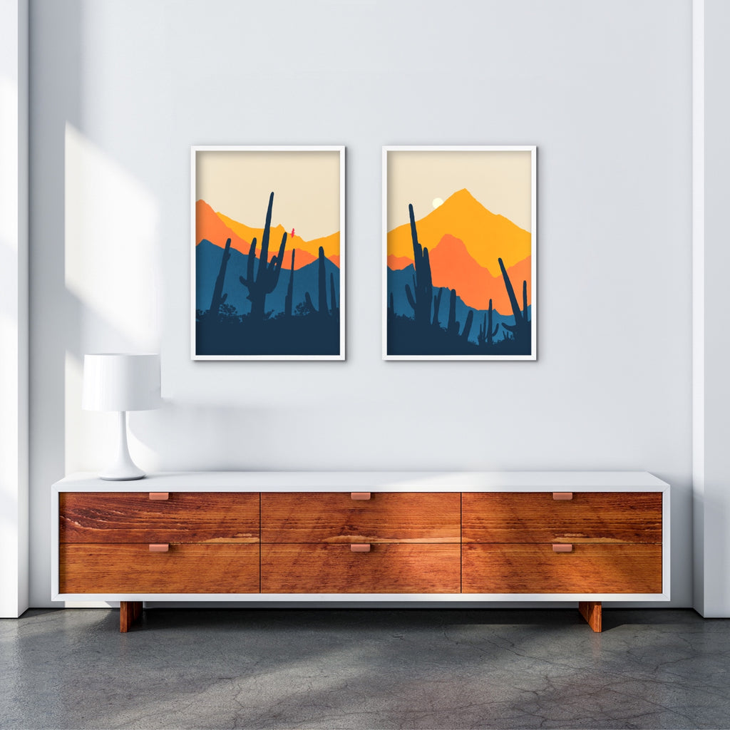 A set of two mid-century desert landscape canvas prints in blue and orange.