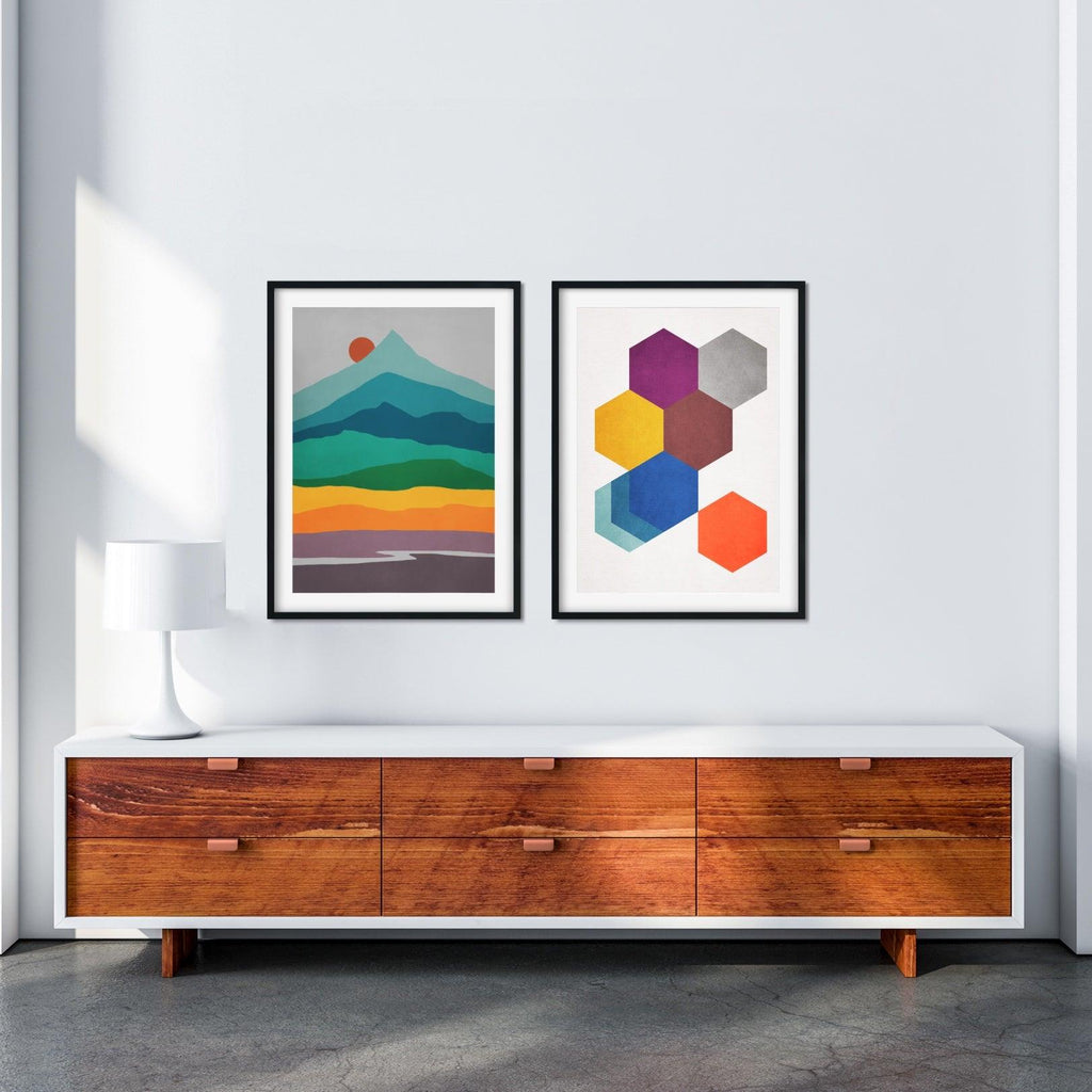 A set of two vibrant mid-century modern abstract wall art prints featuring a minimal landscape print and a hexagon print.