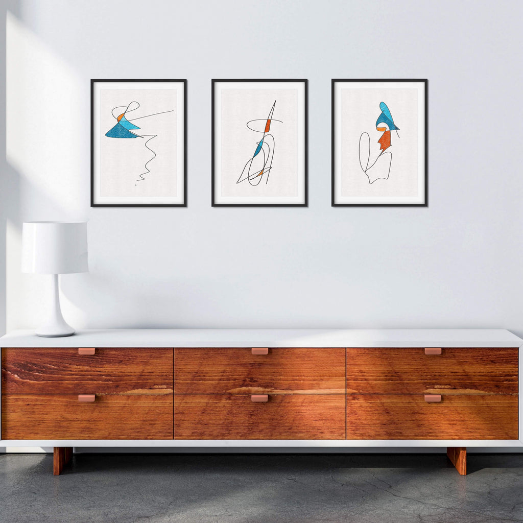A set of three captivating mid-century modern line art prints.