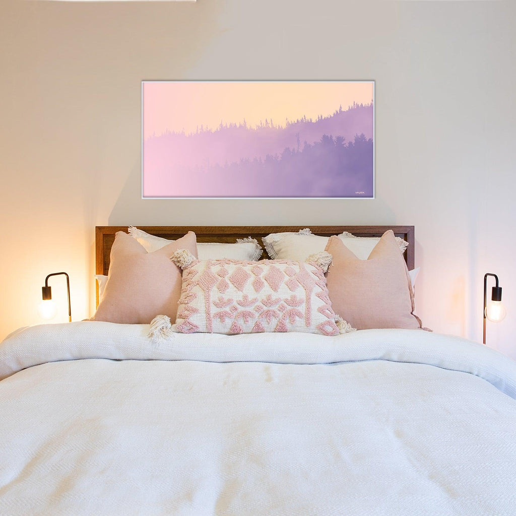 A golden coastal rises above lavender hills in this framed panoramic artwork. 